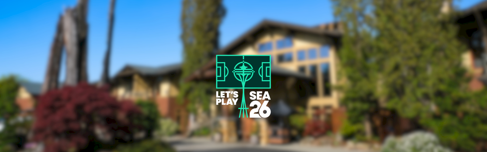 A blurred landscape with a building in the background and a green “Let's Play SEA 26” logo centered in front of it.
