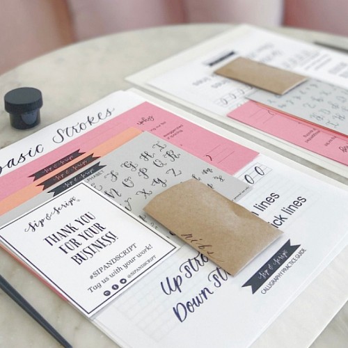 The image shows training materials, including worksheets, notes, and a thank you card, on a table for a calligraphy or handwriting class.