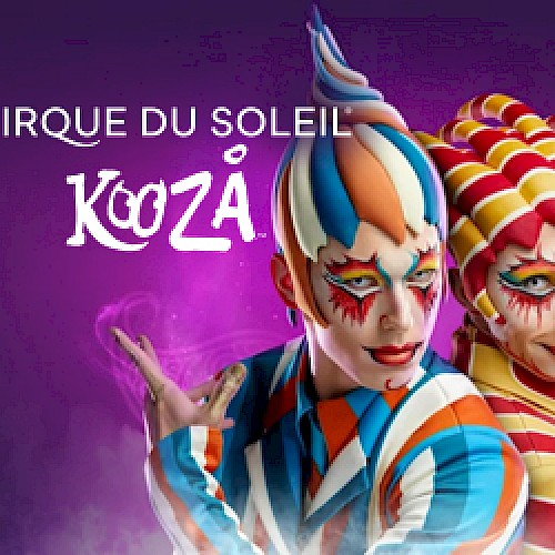 The image shows two performers in colorful costumes and makeup from Cirque du Soleil's Kooza, set against a purple background.